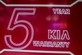 KIA `5 year warranty` Motor Company logo.